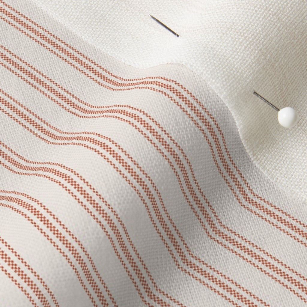 close up of mattress ticking stripe fabric in farmhouse red on off white