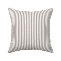 Classic mattress ticking stripe fabric shown on a square pillow. The color of the stripe is charcoal black on off white.