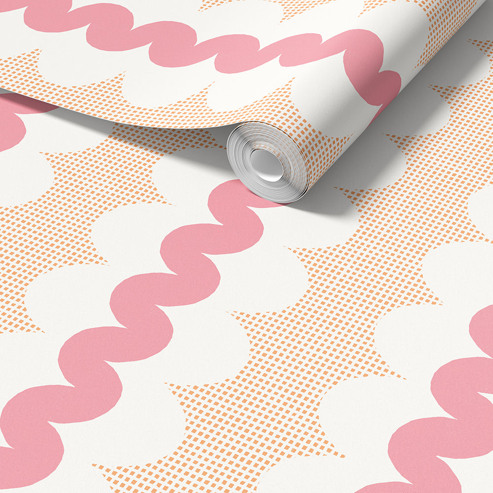 A roll of wallpaper partially unrolled, showing a retro pattern with pink wavy lines, peach square dots and white ovals on a white background.
