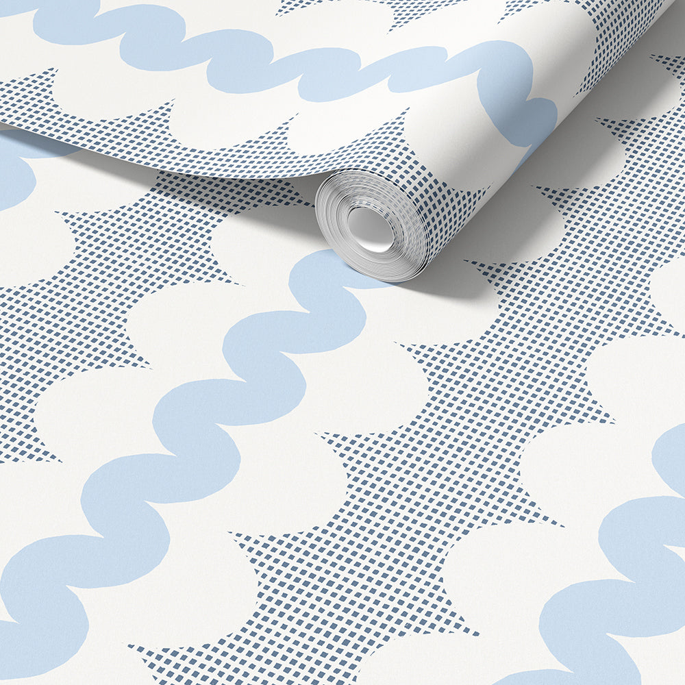 A roll of wallpaper with a repeating pattern of light blue wavy stripes, white cloud-like shapes, and dark blue square dots on a white background.