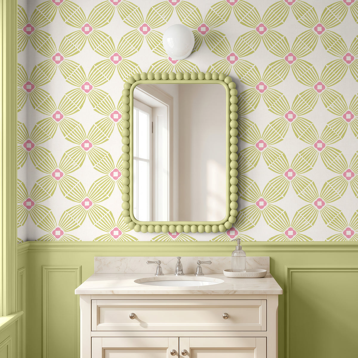 A bathroom vanity featuring a rectangular mirror with a green beaded frame, set against wallpaper with a green and pink geometric pattern and a bright lime green wainscoted wall.