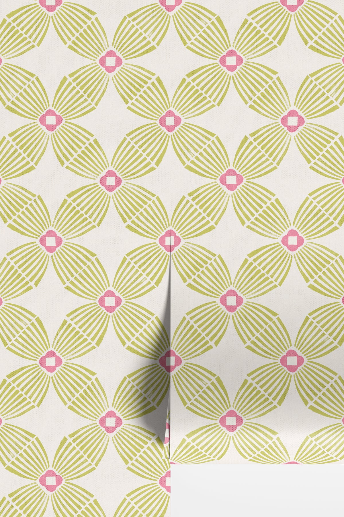 A close-up of wallpaper rolls with a repeating geometric floral pattern in light lime green and hot pink on an off-white background.