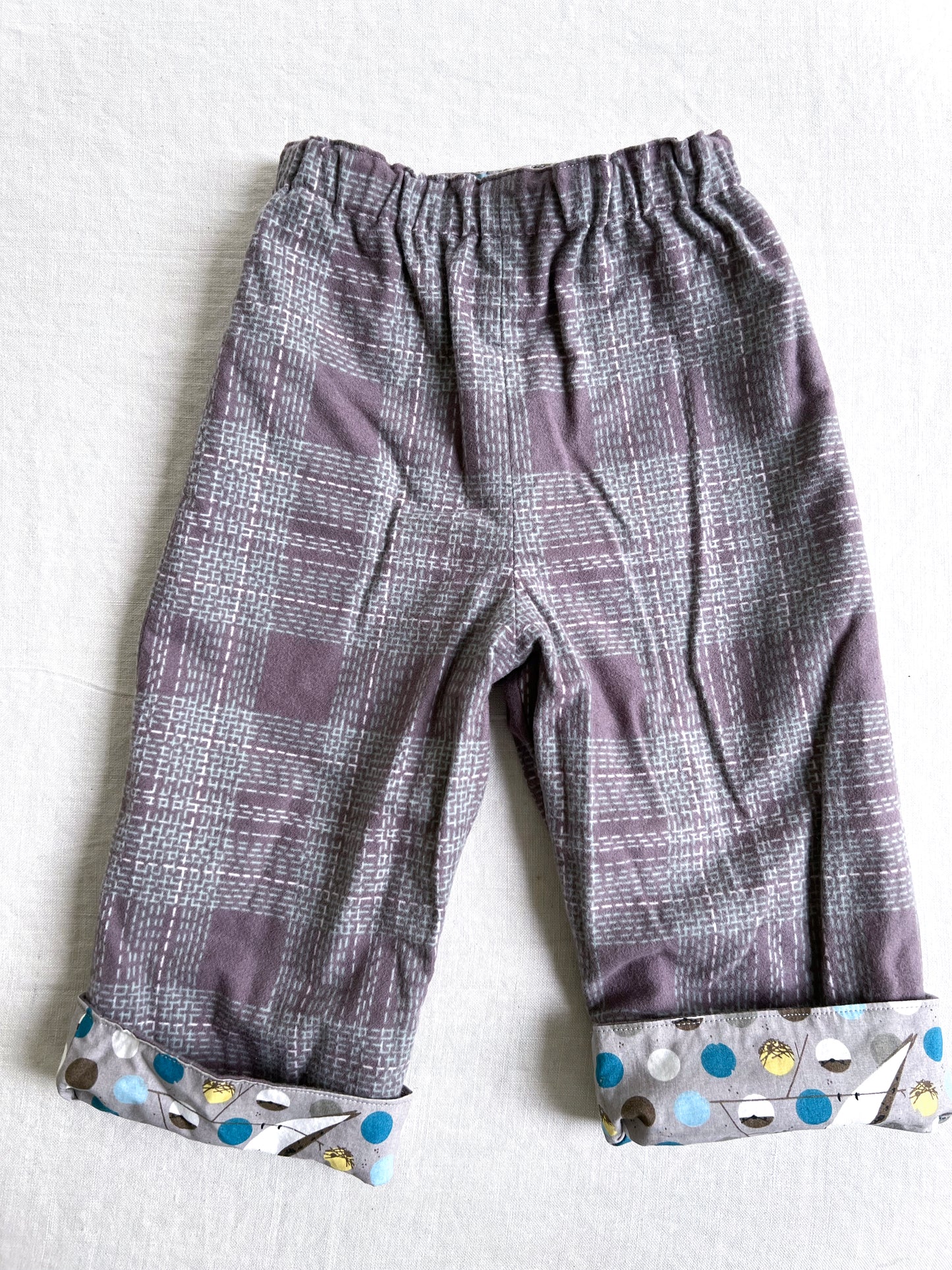 organic cotton reversible pants in barn swallow and plaid flannel