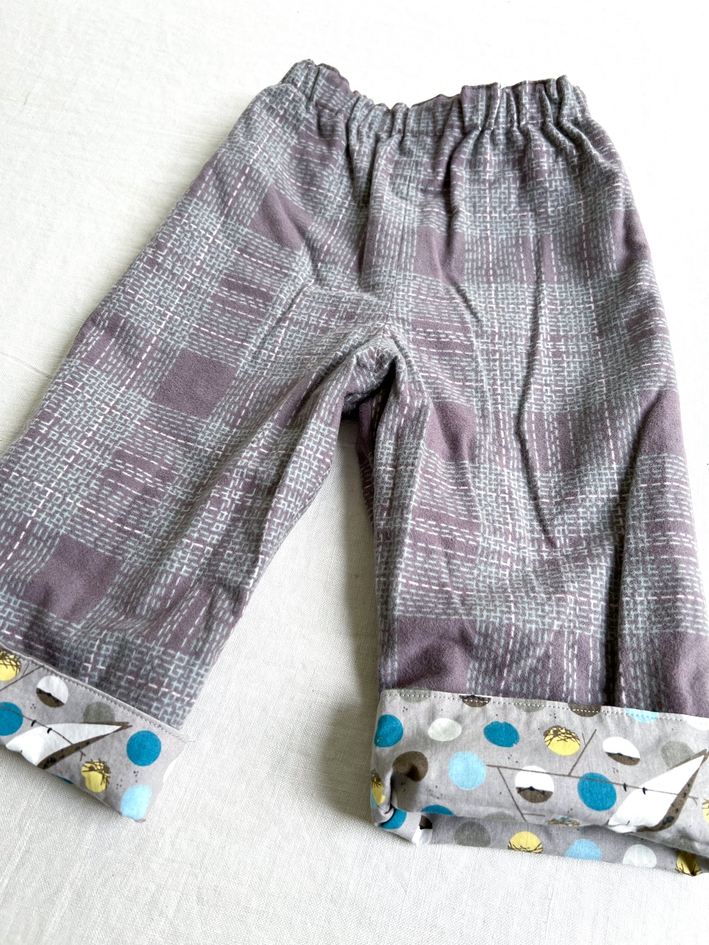 organic cotton reversible pants in barn swallow and plaid flannel