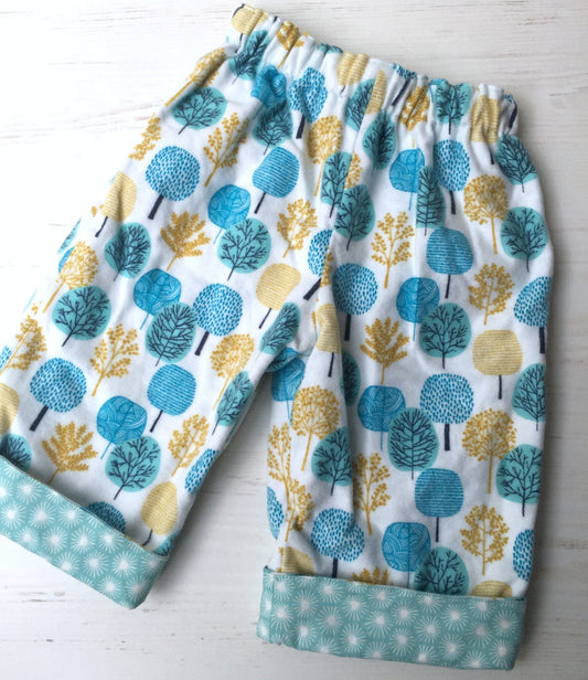 flannel reversible pants in park tree - little girl Pearl