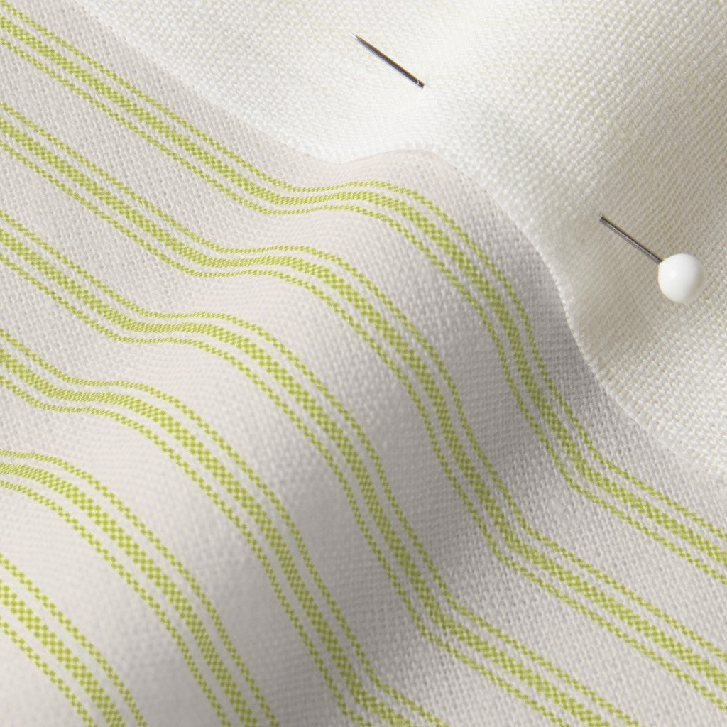 close up of mattress ticking stripe fabric in lime green on off white