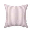 Classic mattress ticking stripe fabric shown on a square pillow. The color of the stripe is magenta on off white.