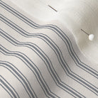 close up of mattress ticking stripe fabric in navy blue on off white