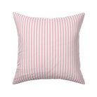Classic mattress ticking stripe fabric shown on a square pillow. The color of the stripe is hot pink on off white.