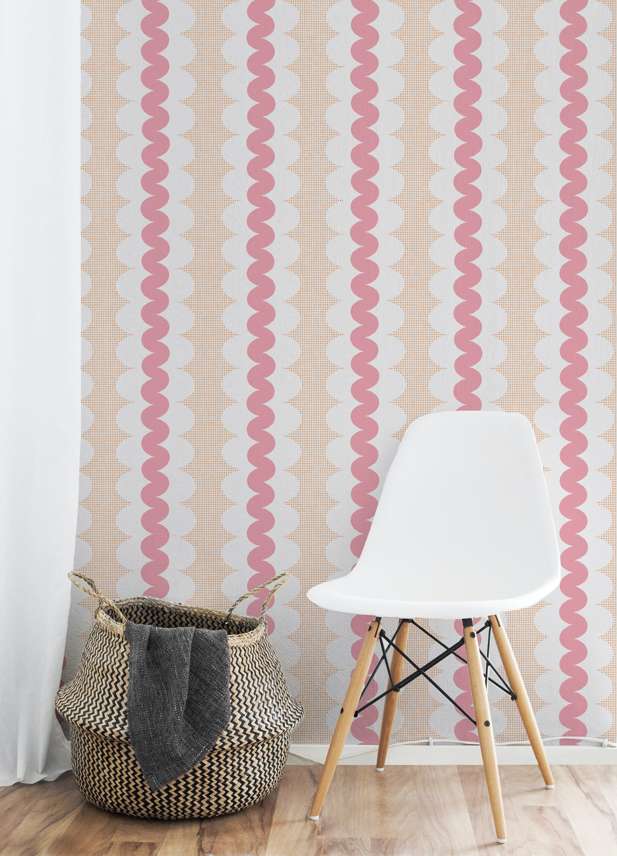 Pink and white wavy vertical stripes wallpaper shown in a styled room setting with a white molded plastic chair and a woven basket on a light wood floor.