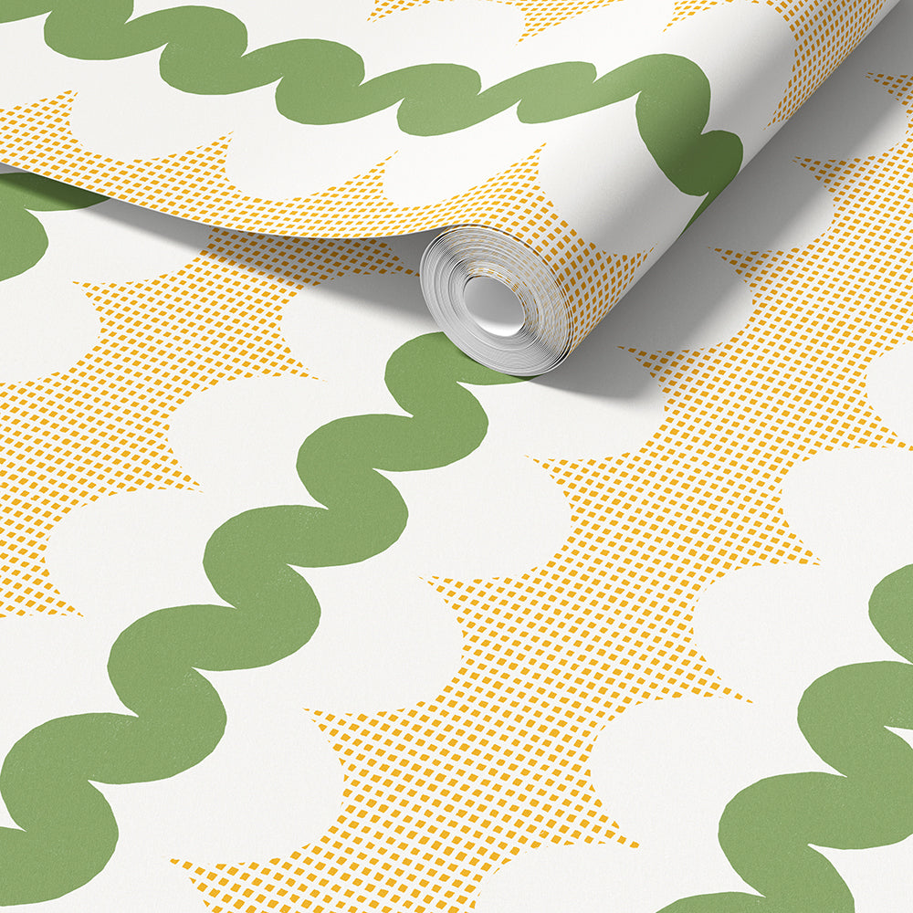 A roll of wallpaper partially unrolled, showing a retro pattern with olive green wavy lines, mustard yellow square grid with  white scalloped oval shapes.