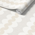 A roll of wallpaper partially unrolled, showing a repeating pattern of beige wavy lines and taupe square grid on a white background.