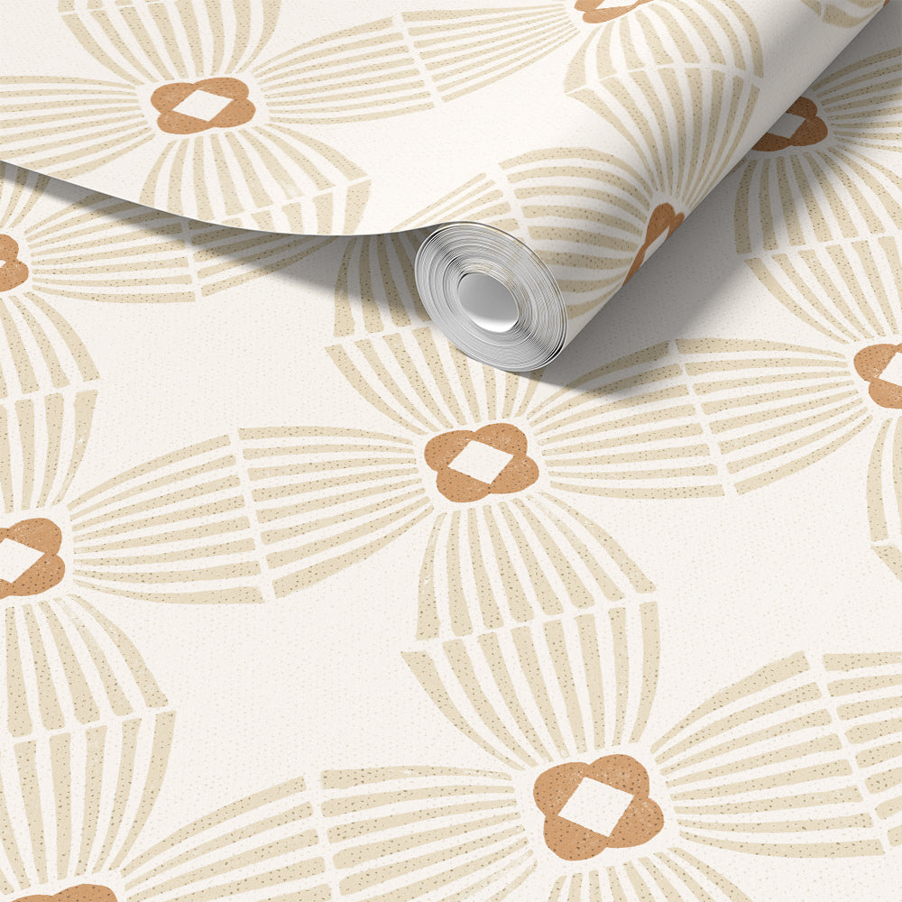 A roll of wallpaper with a repeating geometric pattern in beige and tan on a warm off-white background, shown partially unrolled.