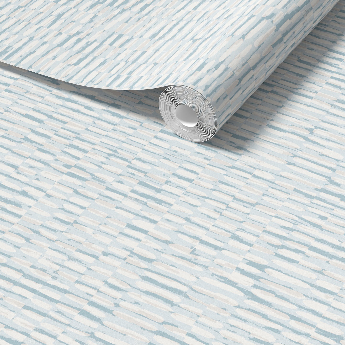 A roll of light beige wallpaper with a subtle horizontal woodgrain pattern, shown partially unrolled over a matching flat surface.