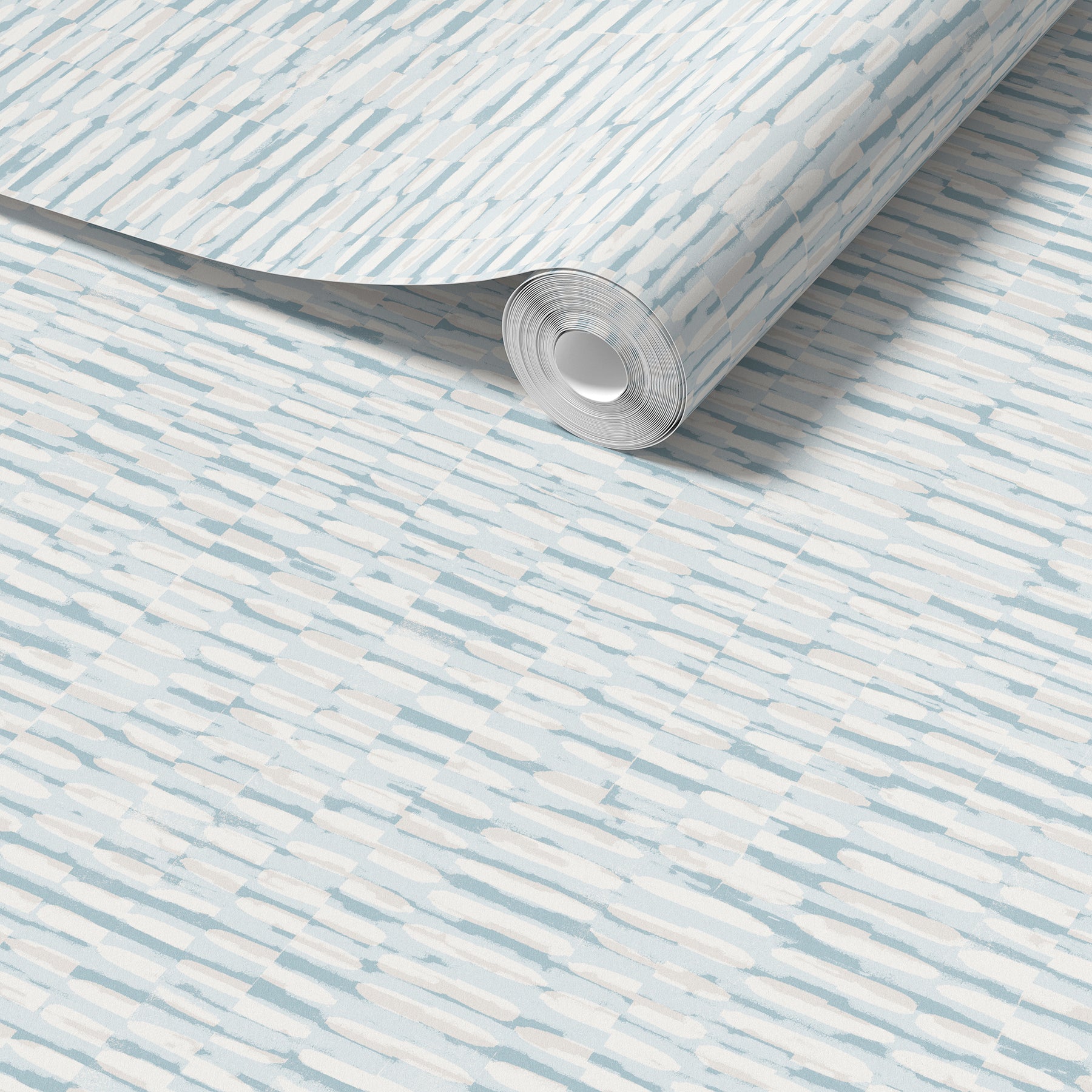 A roll of light beige wallpaper with a subtle horizontal woodgrain pattern, shown partially unrolled over a matching flat surface.