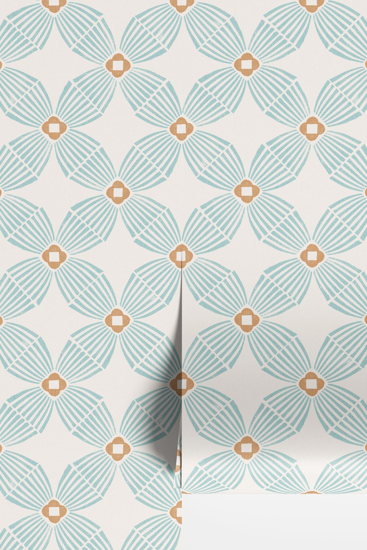 A close-up of wallpaper rolls with a repeating geometric floral pattern in light aqua blue and warm tan on an off-white background.