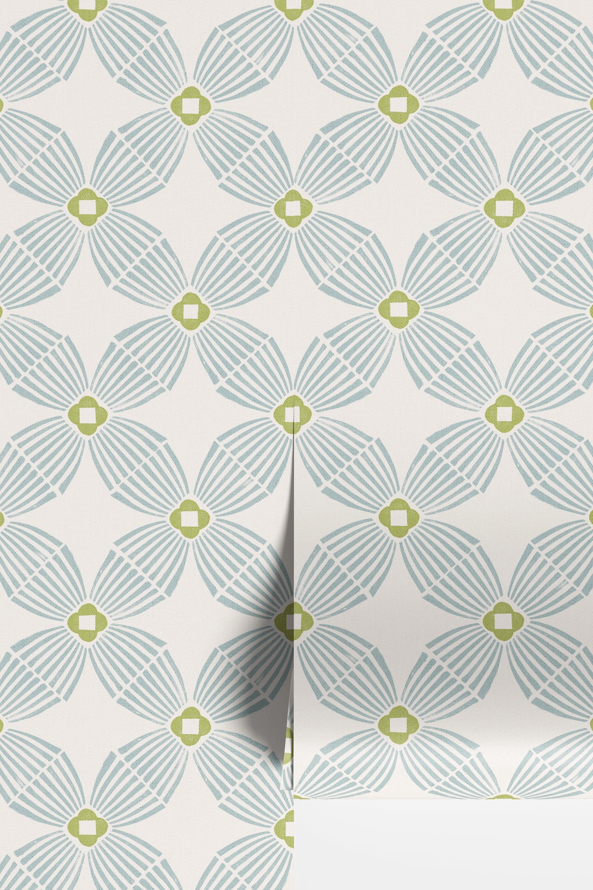 A close-up of wallpaper with a repeating geometric floral pattern in pale blue-gray and muted yellow-green on an off-white background.