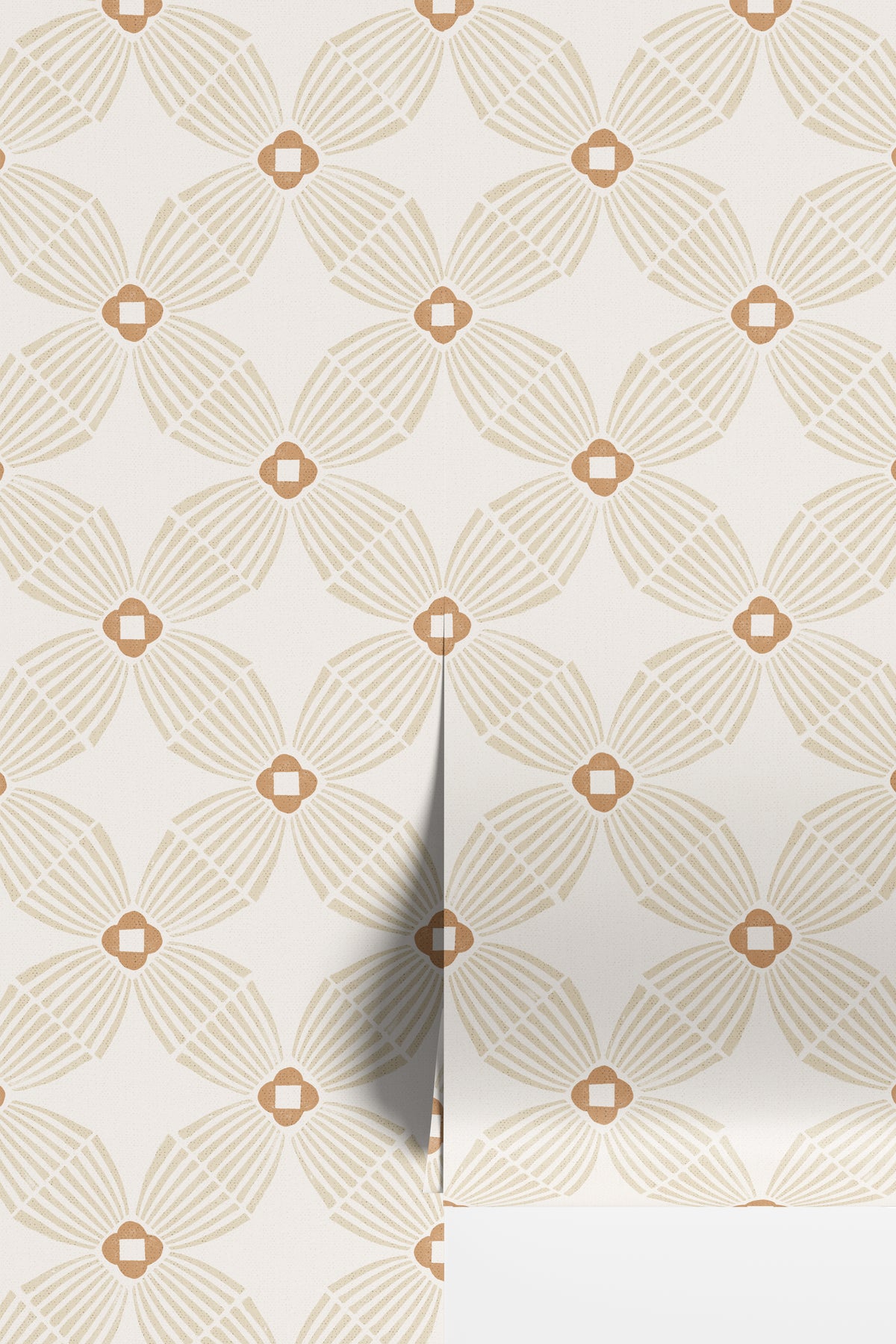 A close-up of wallpaper with a repeating geometric floral pattern in warm beige and tan on an off-white background, with a folded corner showing the surface depth.