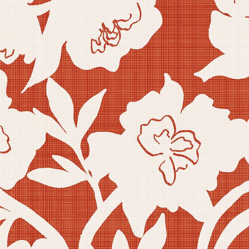 A close-up of a floral patterned fabric or wallpaper featuring large white flowers and leaves over a warm rust-orange textured background.