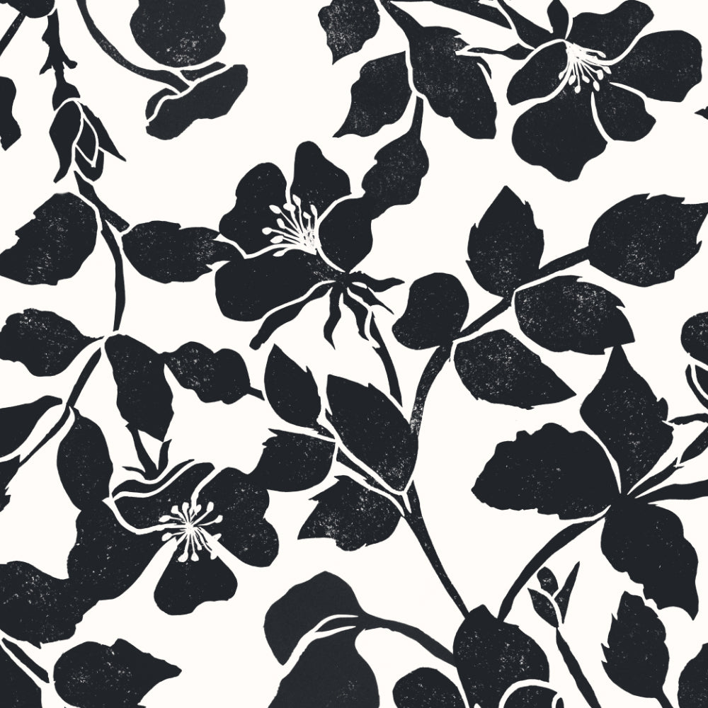 Black floral silhouette pattern with leaves and blossoms on a white background.