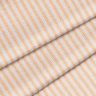 Yardage of striped fabric with saffron and marigold colors, showing the texture and pattern repeat.