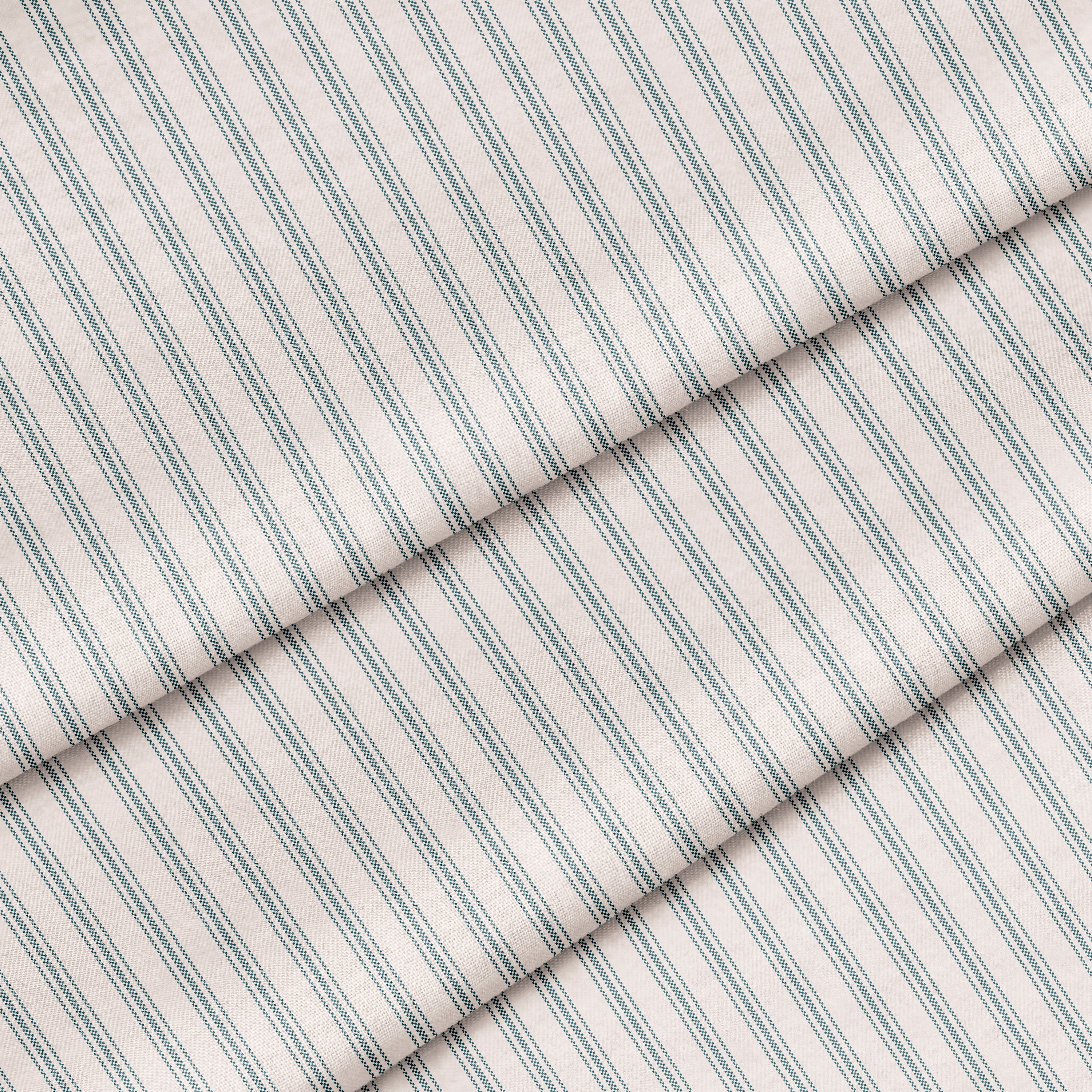 Close up of a classic ticking stripe in stormy gray on off white. The fabric is folded onto itself.