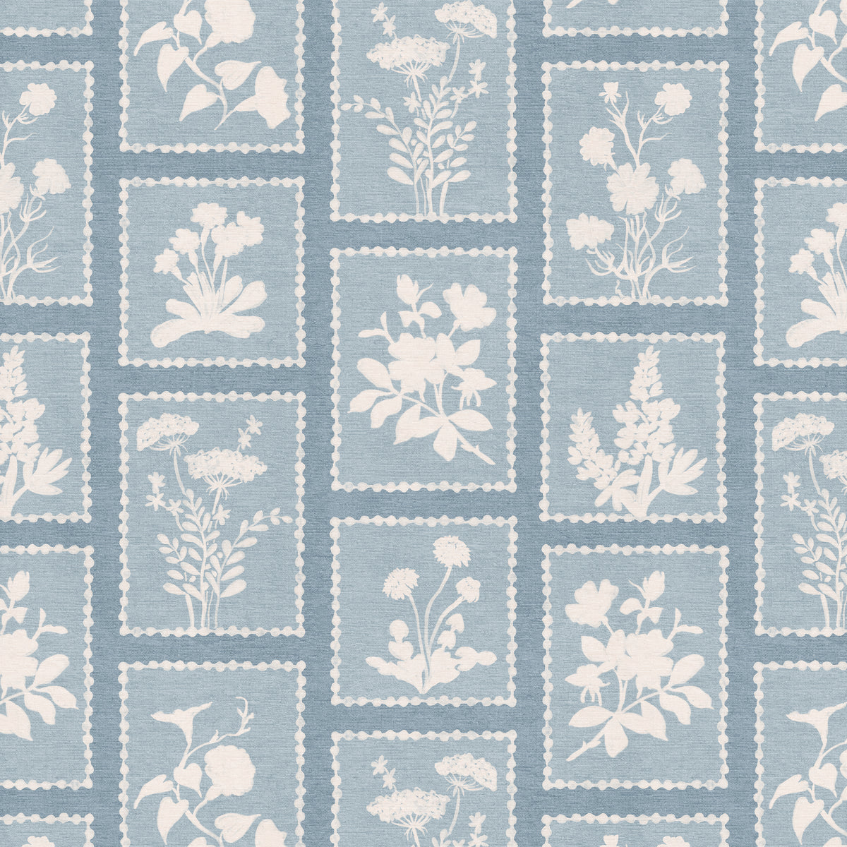 Pattern of framed silhouetted floral designs on a blue background