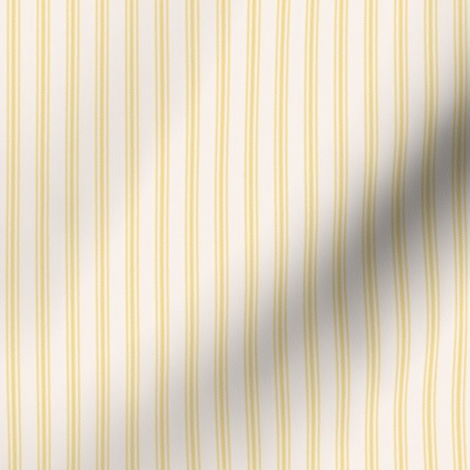 classic mattress ticking stripe fabric in sunny yellow on creamy white